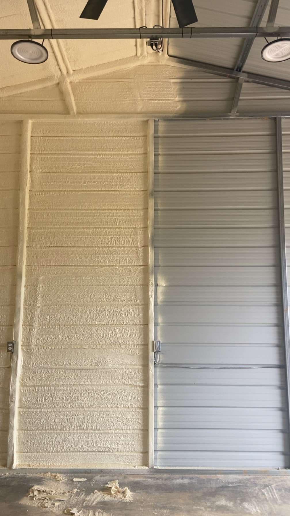 Metal building interior with spray foam